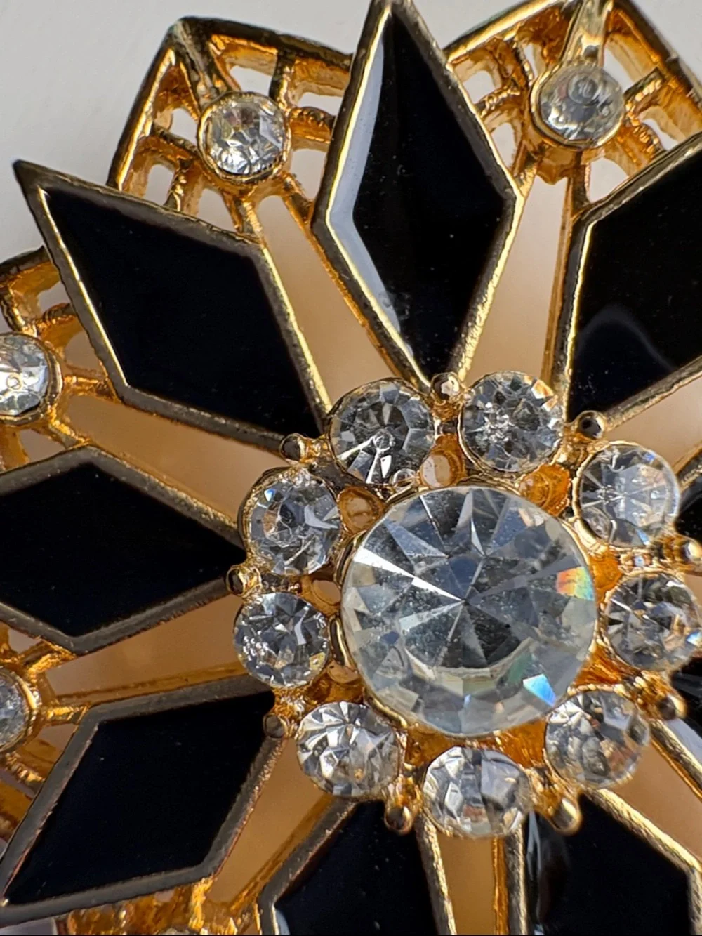 Vintage Gold Tone Black Enamel Starburst Brooch with Clear Rhinestones